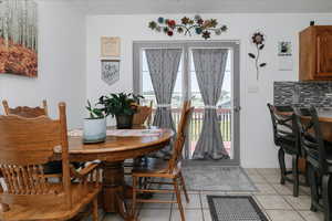 Dining room featuring light tile patterned floors