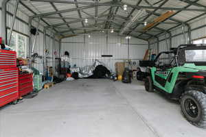 Garage featuring metal wall