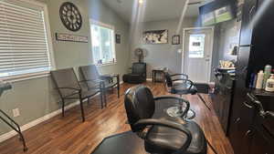 Office space featuring plenty of natural light and wood finished floors