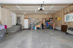 Garage with a garage door opener and gas water heater