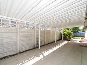 Fenced backyard featuring a patio