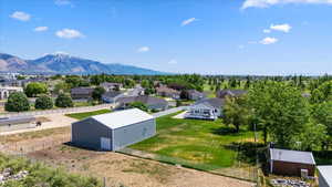 Aerial view of residential area featuring a mountainous background