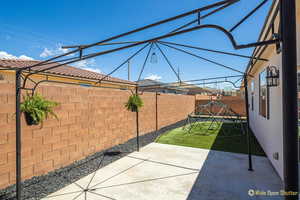 Fenced backyard featuring a patio area
