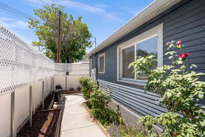 View of side of property featuring a fenced backyard