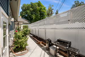 Fenced backyard with a patio area