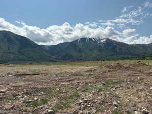 View of mountain background featuring rural landscape