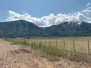 View of mountain backdrop featuring rural landscape