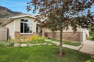 View of front facade with brick siding and a mountain view