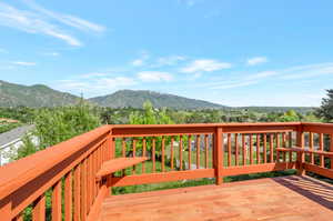 Wooden deck featuring a mountain view