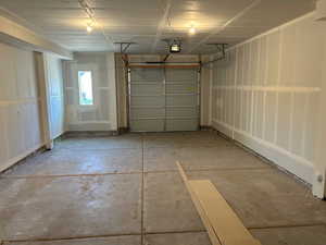 Garage featuring a garage door opener