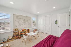 Playroom/bedroom with carpet and recessed lighting