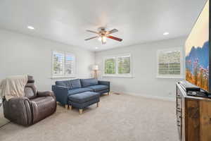 Upstairs Living area featuring light carpet, a ceiling fan, recessed lighting, and loads of natural light