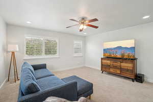 Upstairs Living area with carpet flooring, ceiling fan, recessed lighting, and baseboards