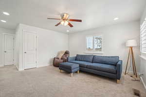 Upstairs Living area with a ceiling fan, light carpet, recessed lighting, and baseboards