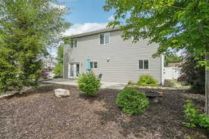 Rear view of property with a patio