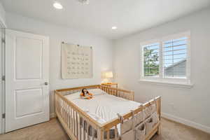 Bedroom featuring carpet floors, baseboards, and recessed lighting