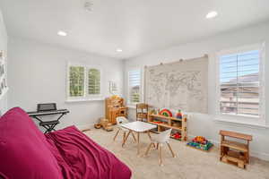 Bedroom or playroom featuring baseboards, recessed lighting, and carpet