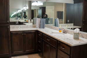 Bathroom with vanity and tile patterned flooring