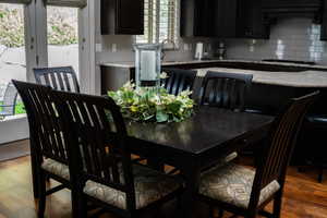 Dining area featuring wood finished floors