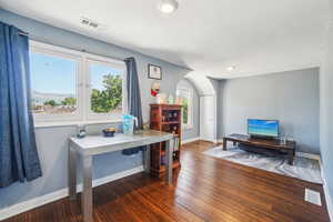 Home office (bedroom too)  with baseboards and wood floors