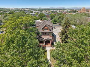 Aerial view of property and surrounding area with mountains