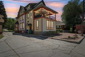 View of home's exterior featuring a glorious lit balcony