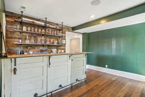 Indoor dry bar featuring super cool shelving!