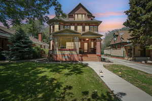 Victorian-style house featuring formal walkways and driveway