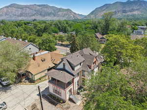 Aerial view of residential area featuring a mountainous background