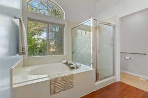 Full bath with a garden tub and a stall shower