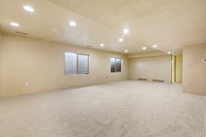 Unfurnished room with carpet floors and recessed lighting