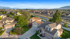 Aerial perspective of suburban area featuring a mountain backdrop