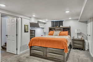 Carpeted bedroom featuring recessed lighting and baseboards