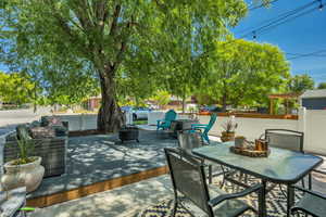 View of patio / terrace with a fire pit and outdoor dining area