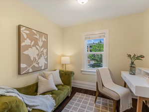 Home office with wood finished floors and baseboards