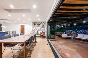 Dining area featuring light wood finished floors and recessed lighting