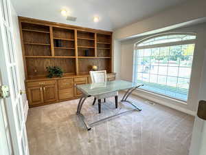 Office with built-ins and double doors.