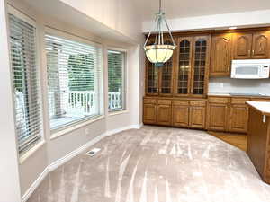 Kitchen breakfast nook with bay window.