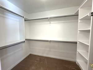 Primary bedroom walk in closet