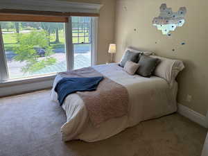Primary bedroom up with big windows overlooking Liberty Park