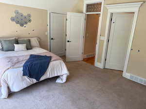 Primary bedroom up with door out to hall and one into bath up
