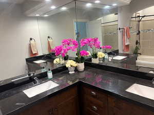 Bathroom down with double vanities