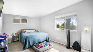 Carpeted bedroom featuring baseboards