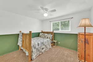 Bedroom featuring carpet floors and ceiling fan