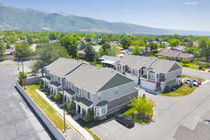 Aerial perspective of suburban area featuring a mountainous background
