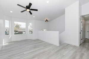 Spare room featuring recessed lighting, light wood-style floors, baseboards, and ceiling fan