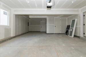 Garage featuring a garage door opener