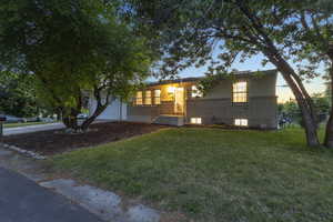 View of front of house featuring brick siding and driveway