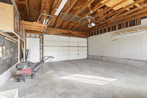 Garage featuring a garage door opener