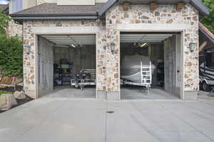 Garage featuring concrete driveway